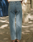 Jeans a vita media con borchie laterali